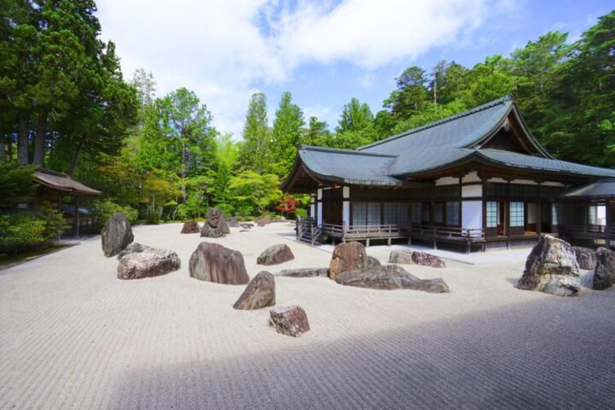 a large group of rocks in front of a building