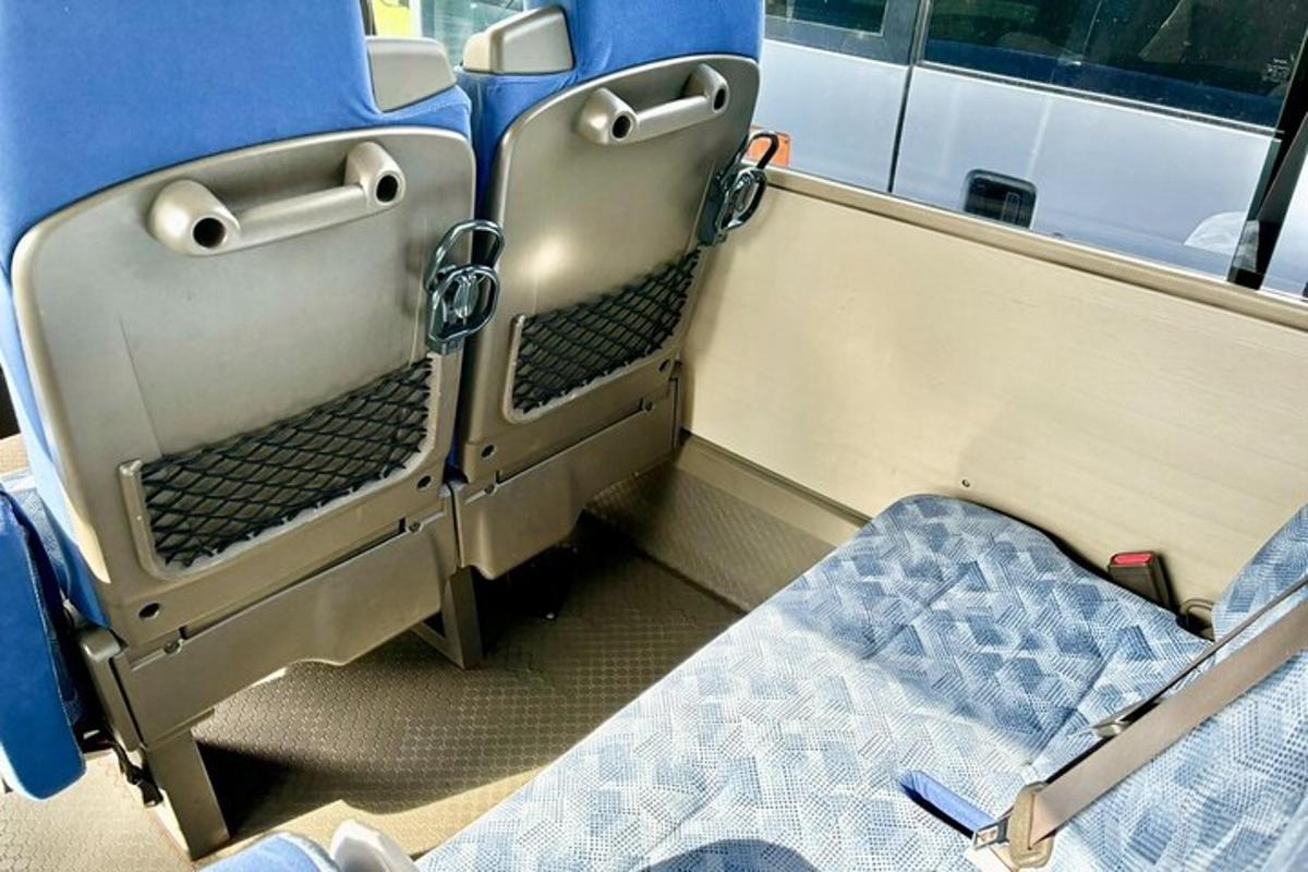 a room with a bed in a train car