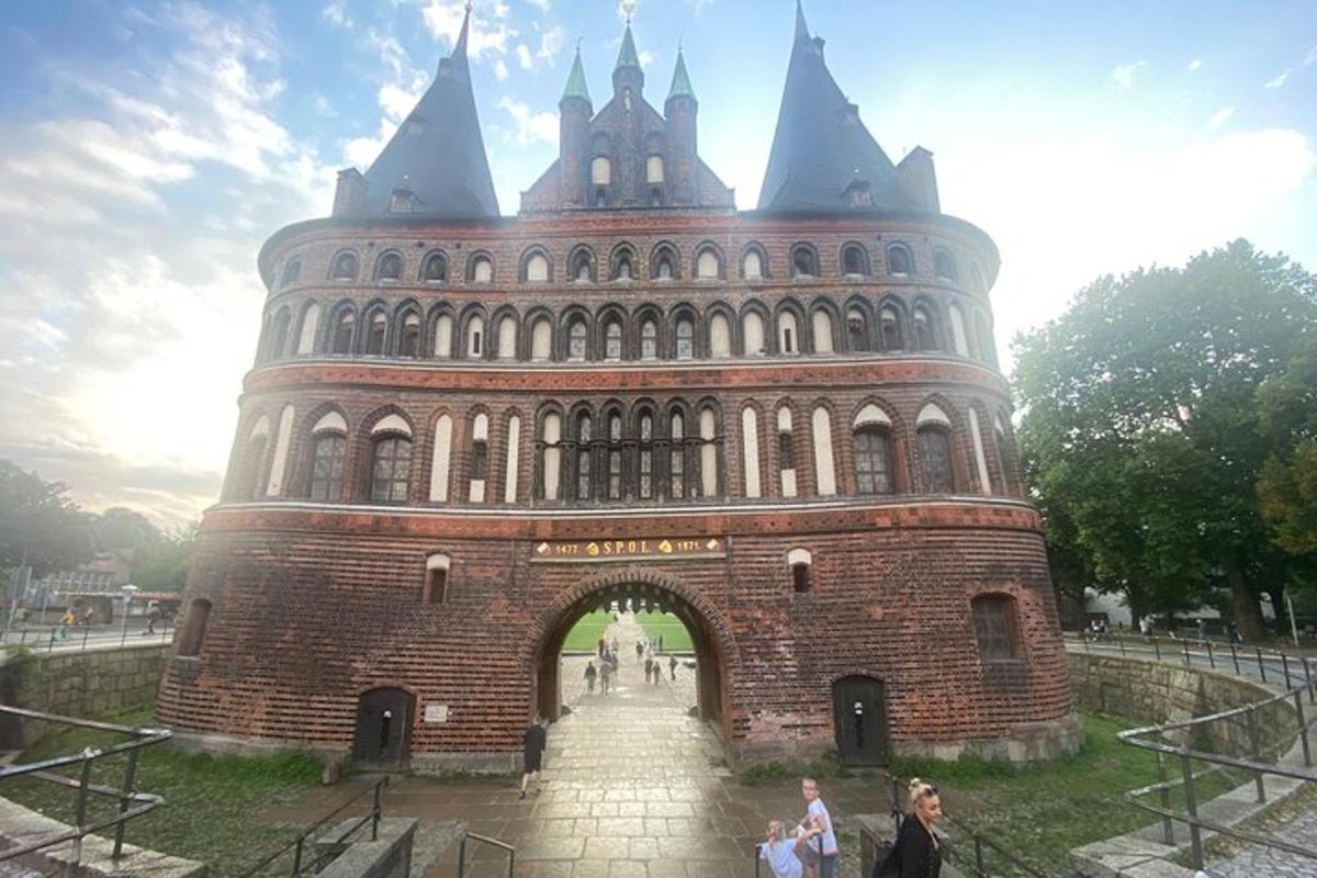 a large brick building with an arch way