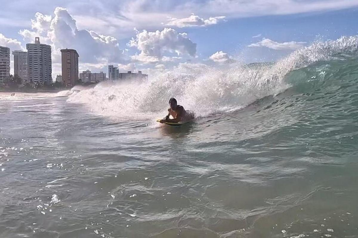 a man riding a wave on a surfboard in the ocean