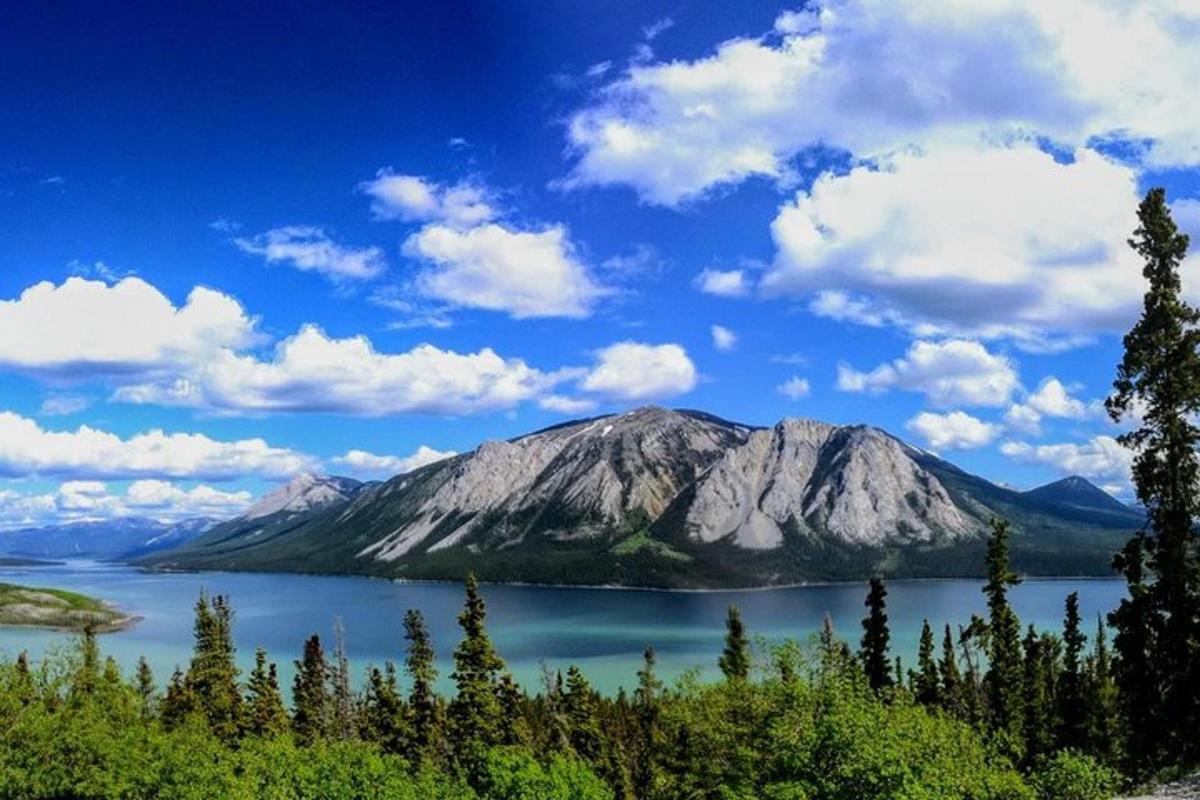 a mountain in the middle of a body of water