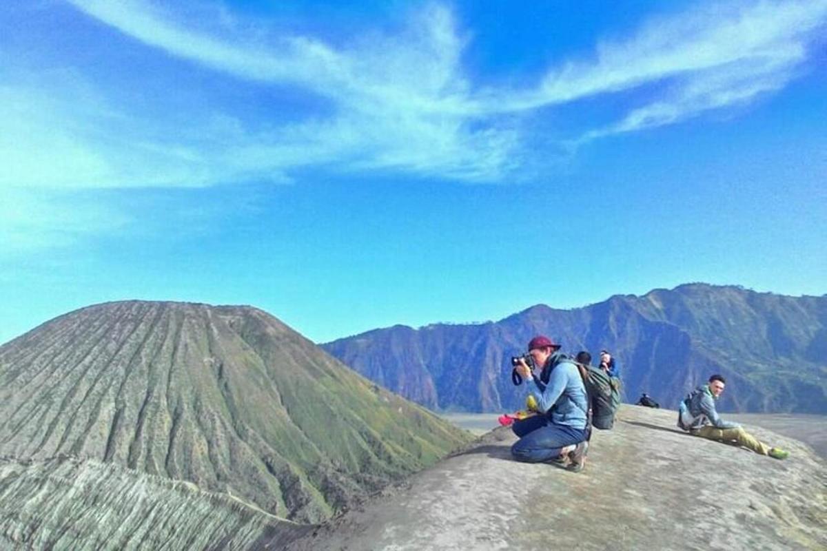 a group of people sitting on top of a mountain