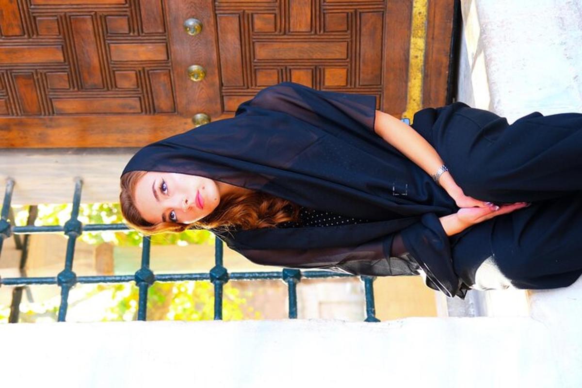 a woman is laying on a step in front of a door