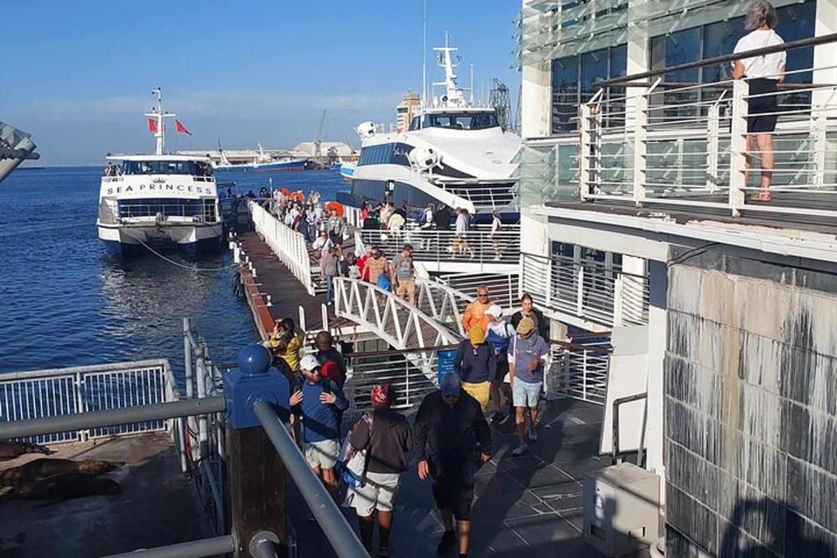 a group of people standing on a cruise ship