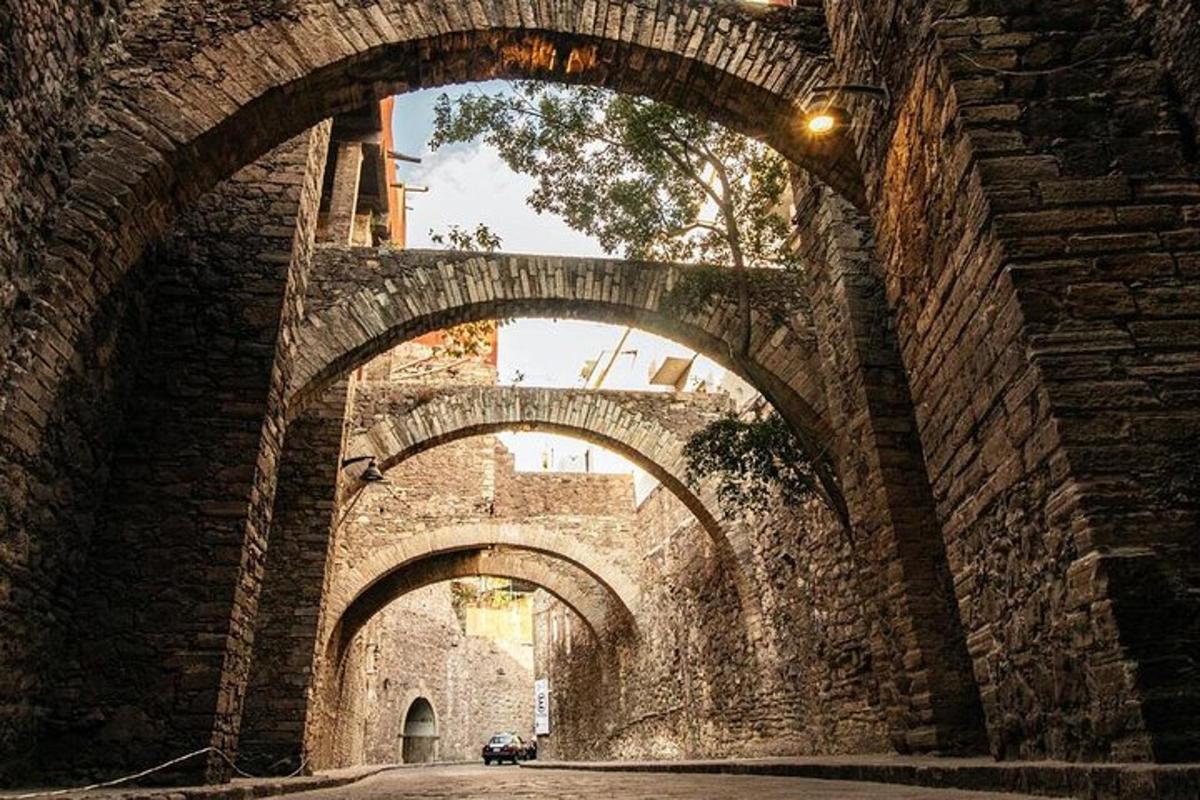 an old stone bridge with three arches on it