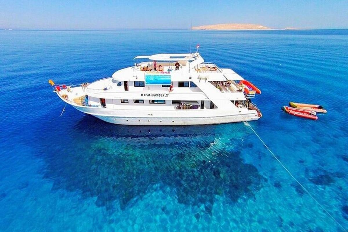a white boat in the middle of the water