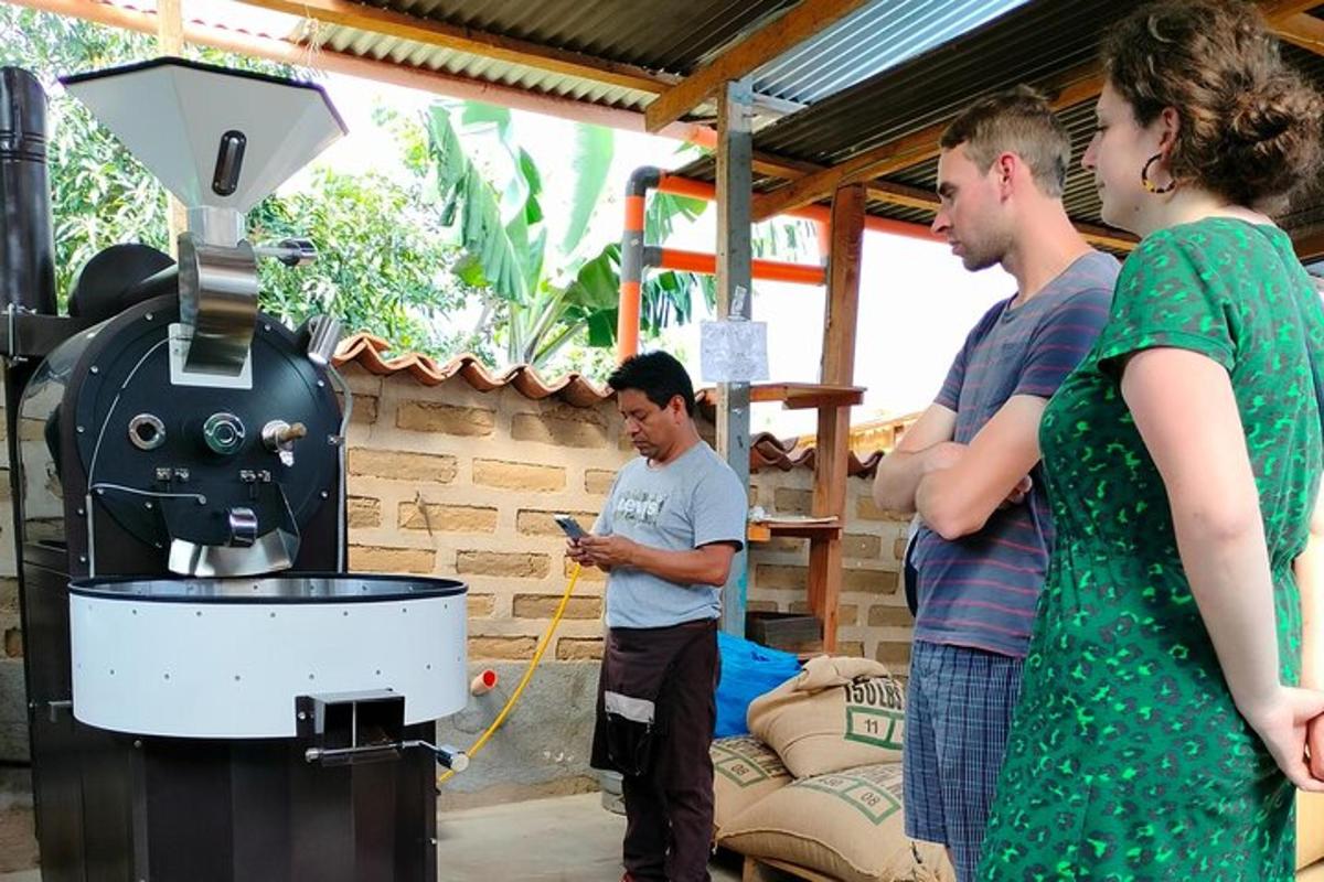 a group of people standing next to a machine