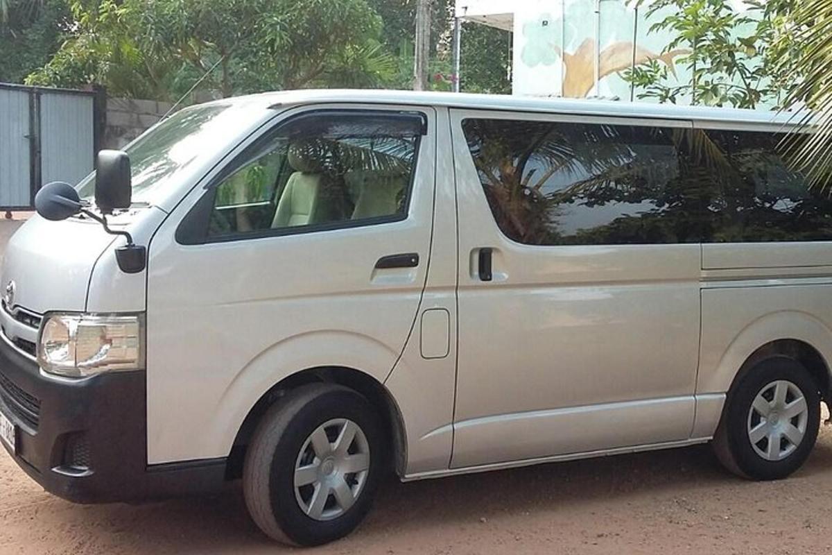 a white van is parked in a parking lot