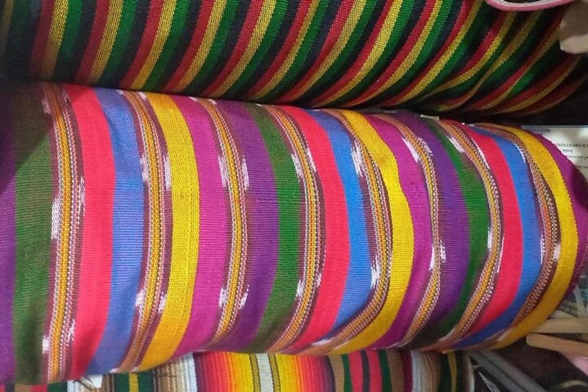 a stack of colorful wrapping paper on a shelf