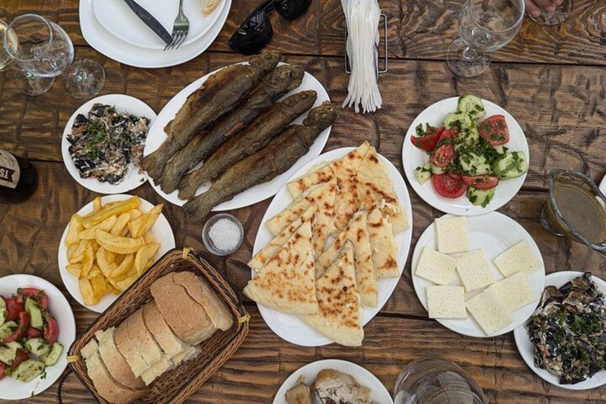 a wooden table with plates of food on it