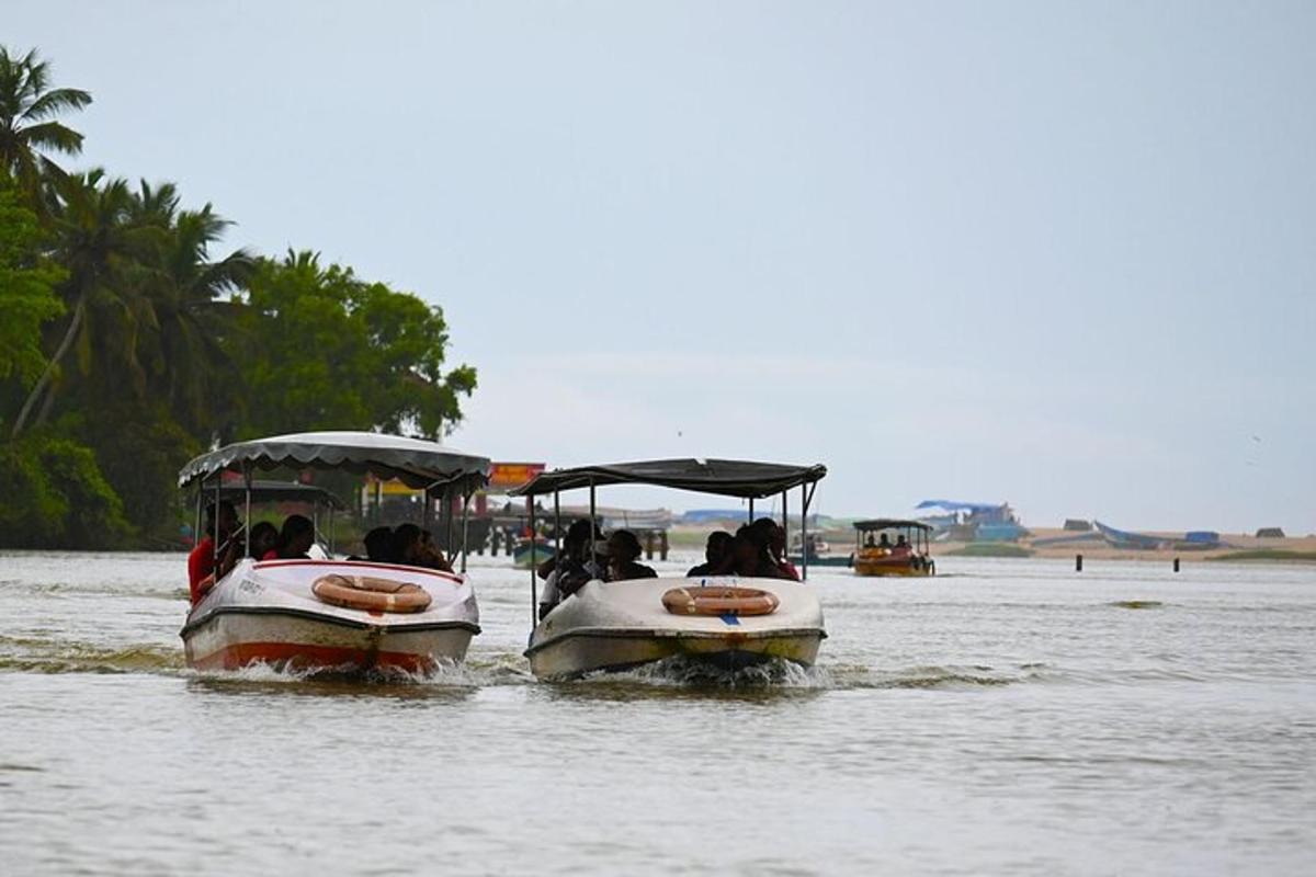 two boats in the water with people on them