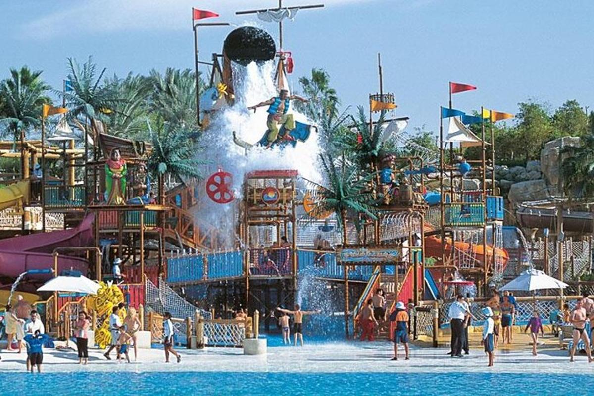 a group of people playing in a water park