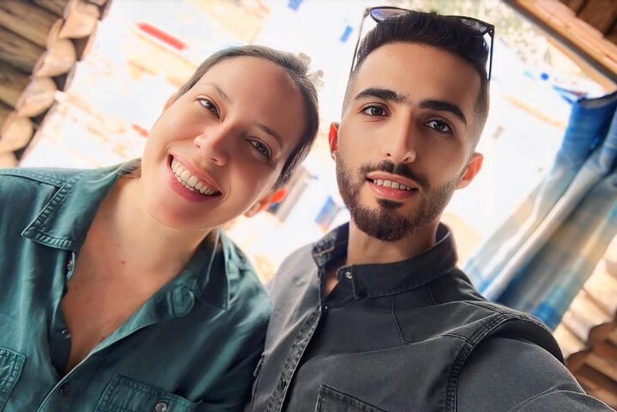 a man and a woman posing for a picture