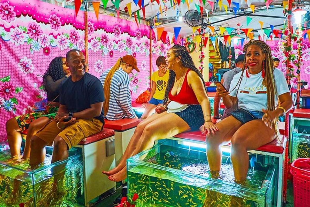 a group of people sitting in a fish tank