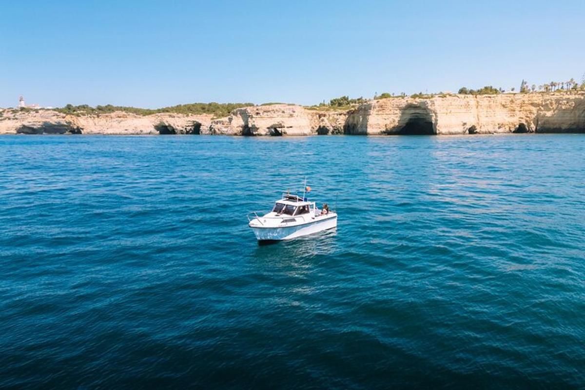a white boat in the middle of the water