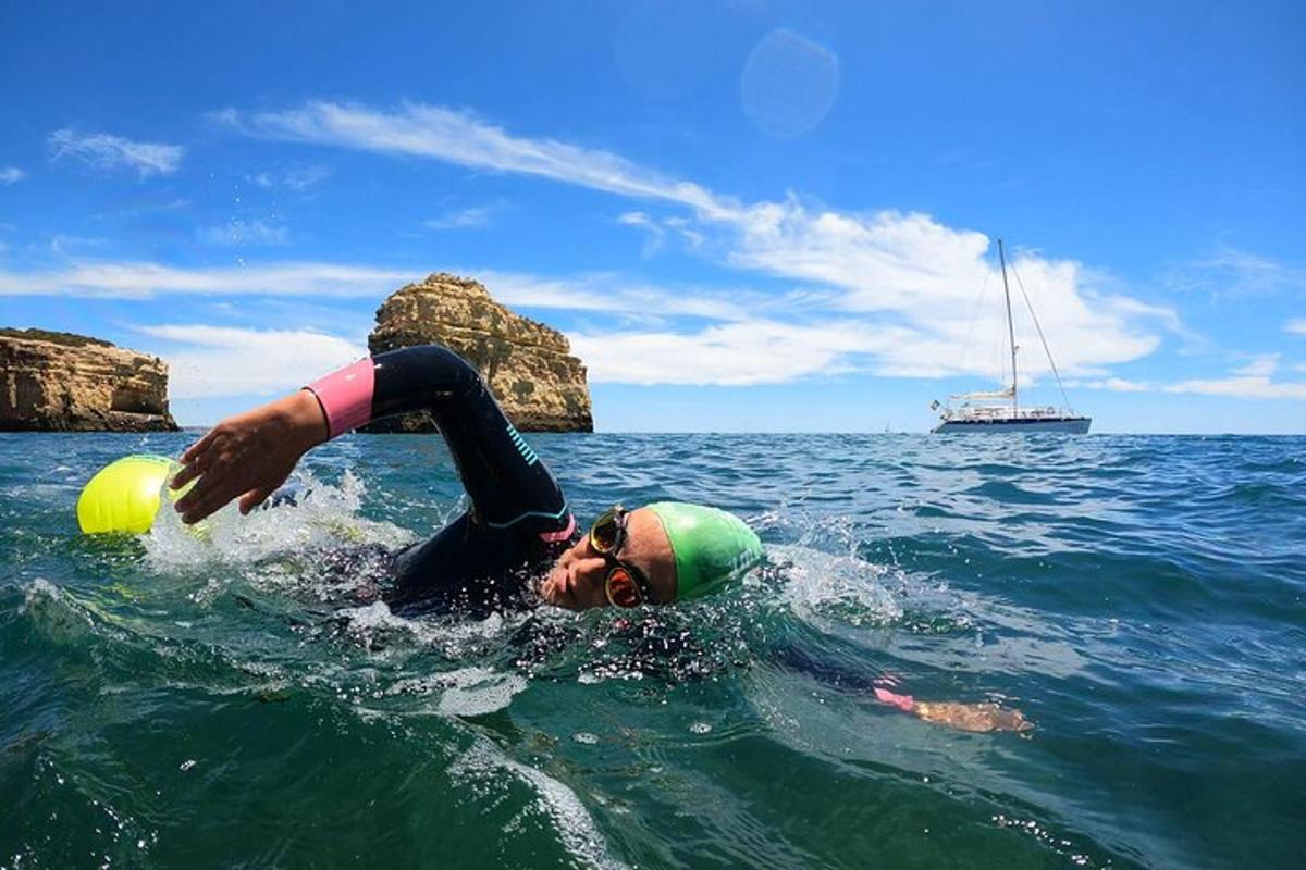 a man laying in the water in the ocean