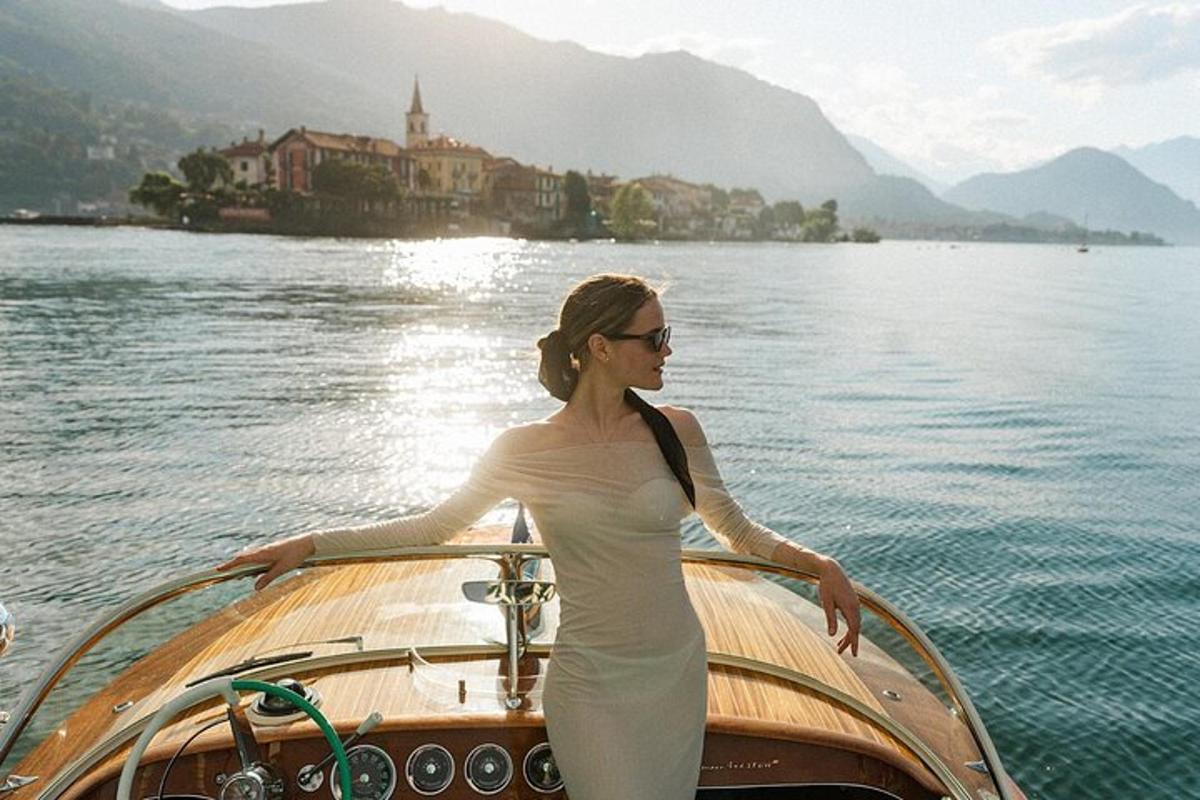 a woman standing on the front of a boat