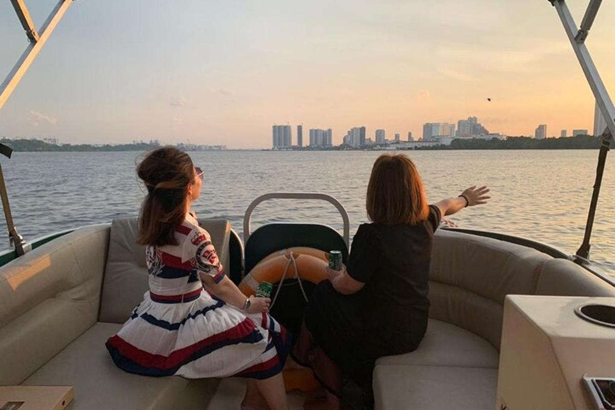 two women sitting on a boat in the water