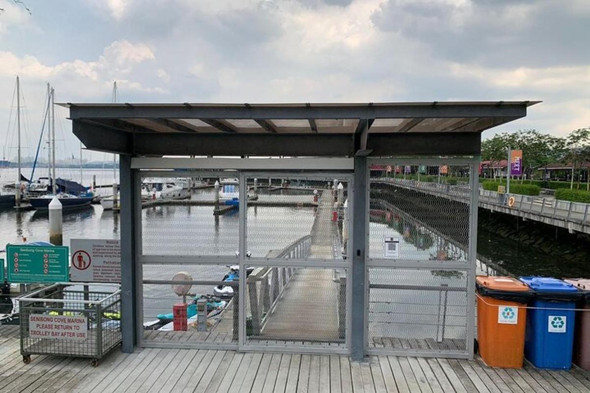 a shelter on a dock next to a marina