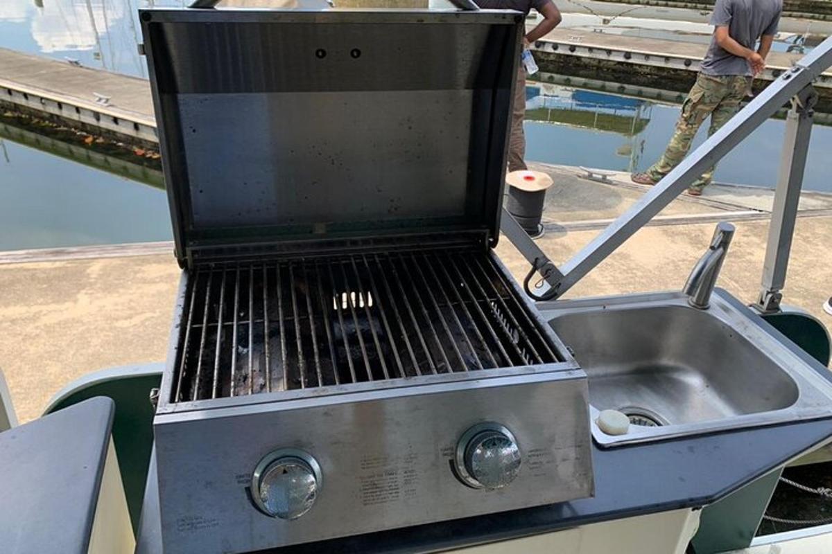 a grill sitting on top of a boat