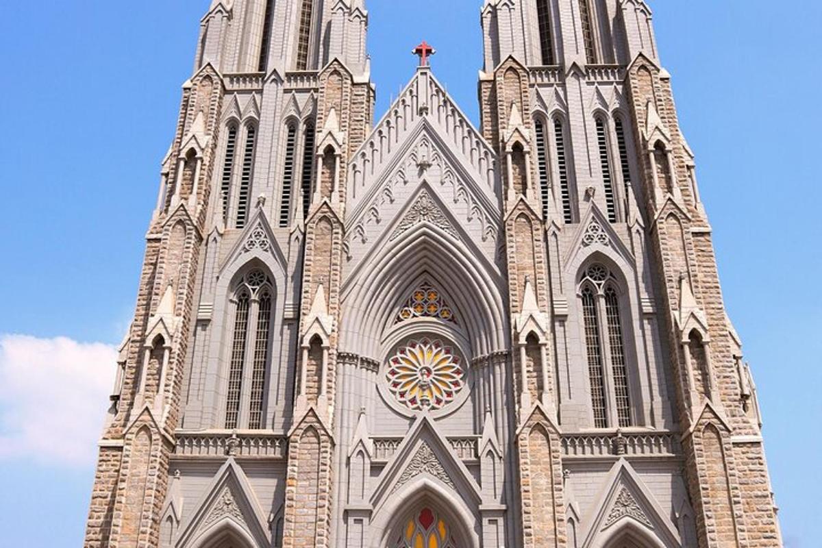 a large church steeple with a cross on top of it