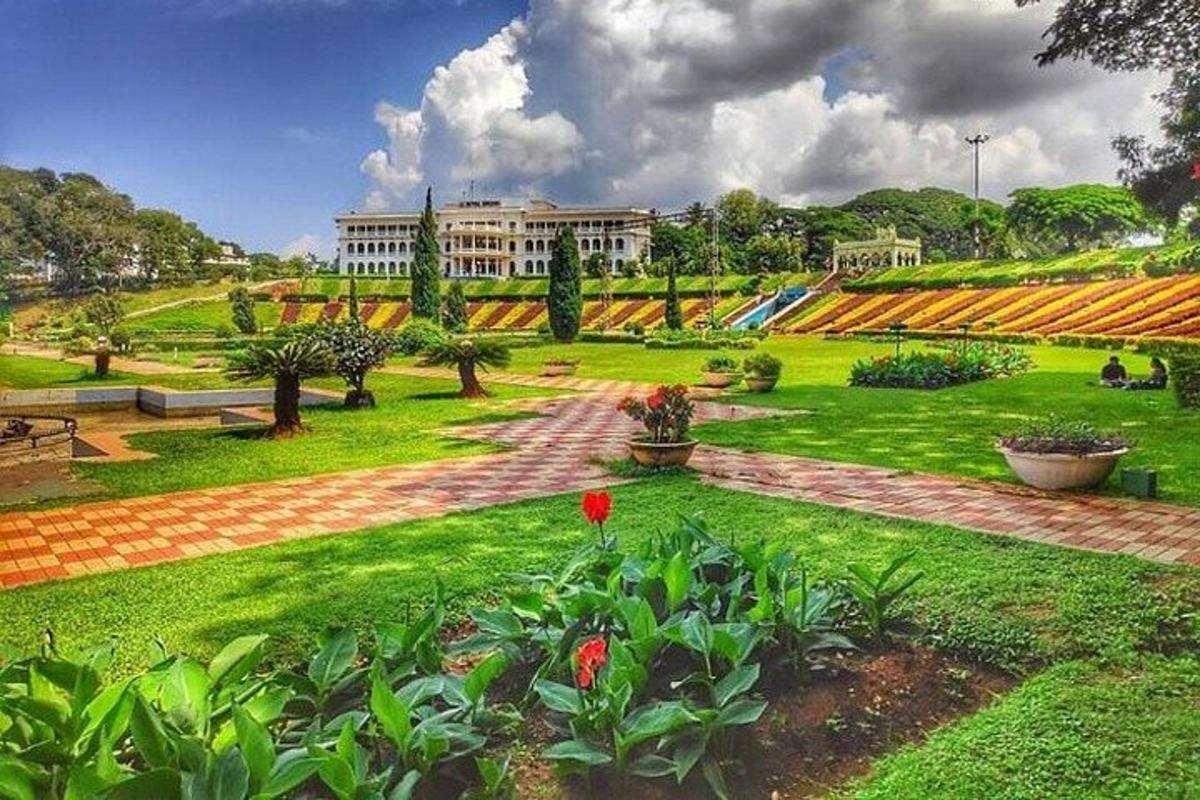 a green park with a building in the background