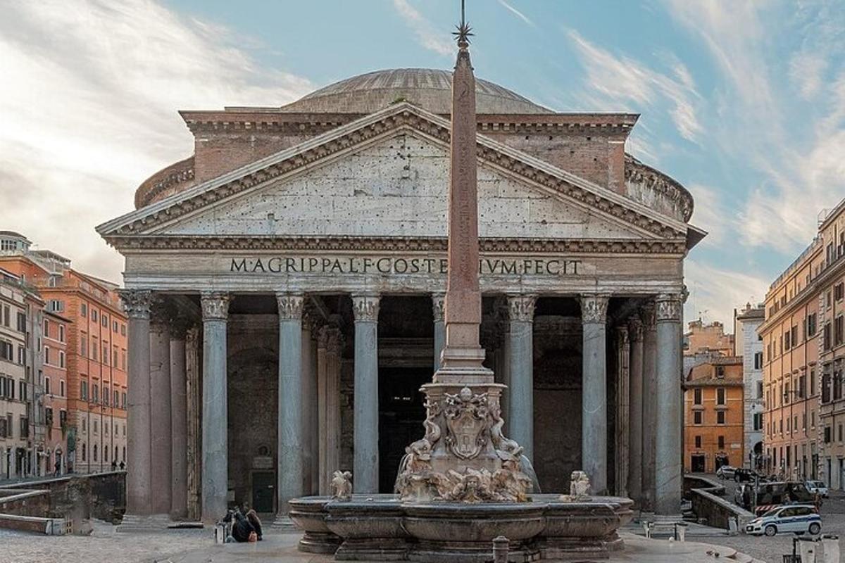 a large building with a fountain in a city