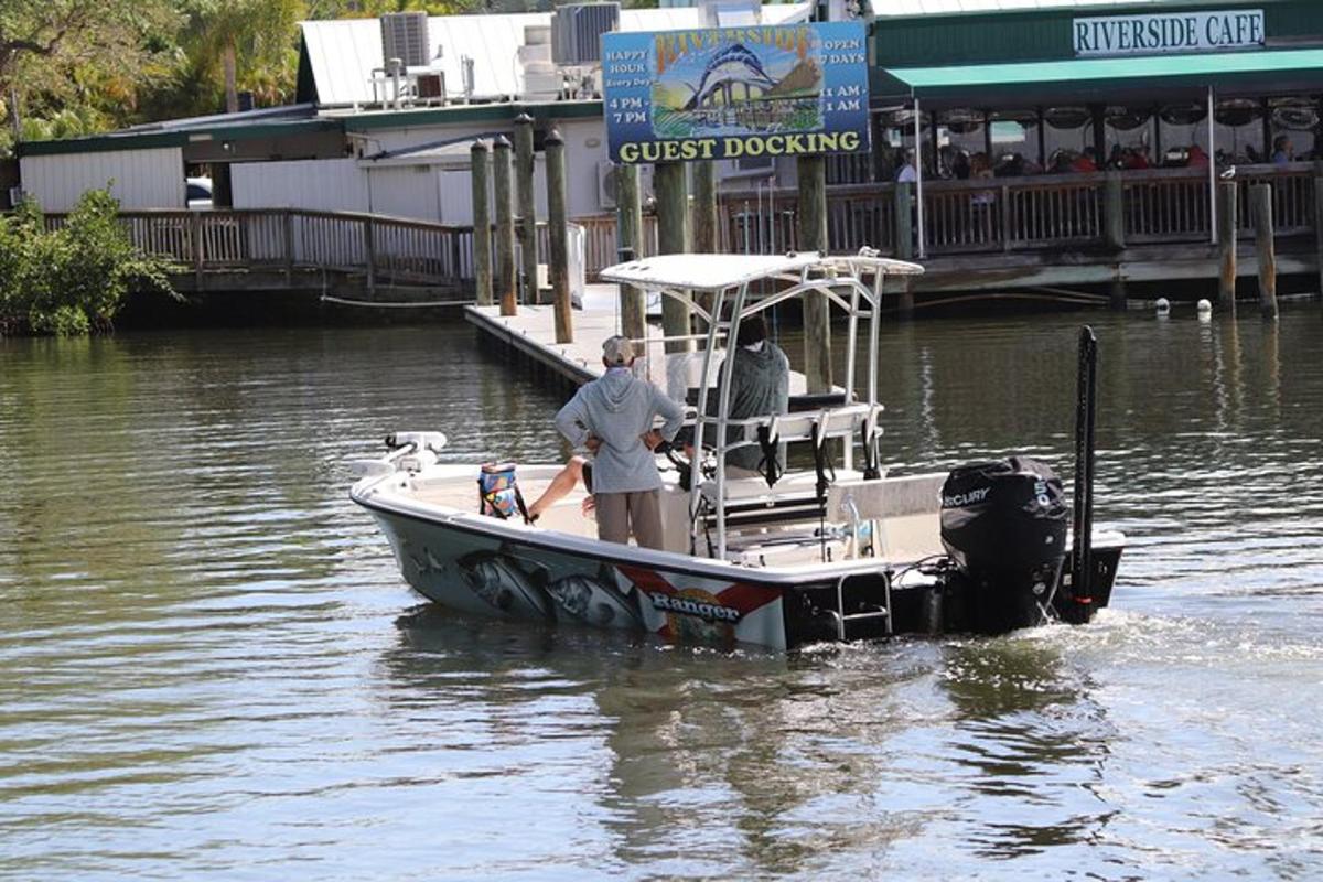 a man standing on a boat in the water