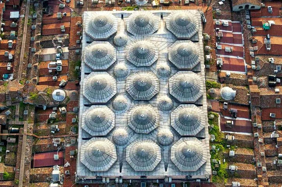 an overhead view of a building with many umbrellas