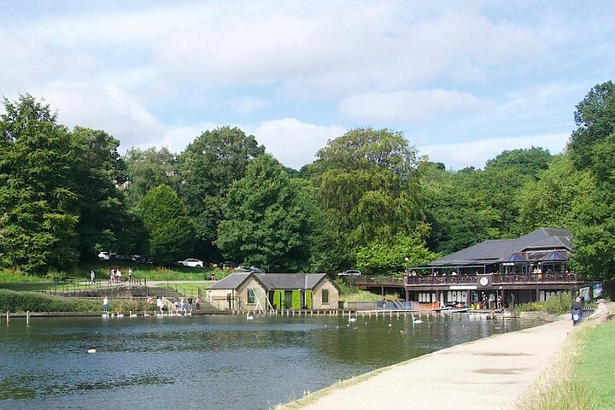 a building next to a body of water with people