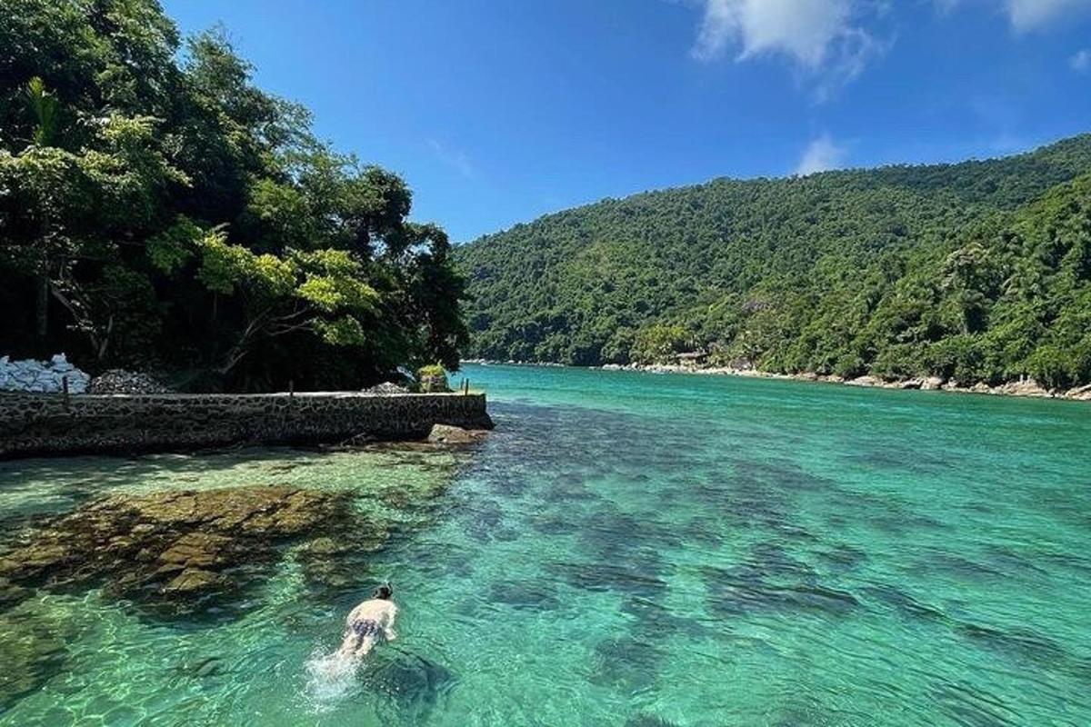a man swimming in a body of water