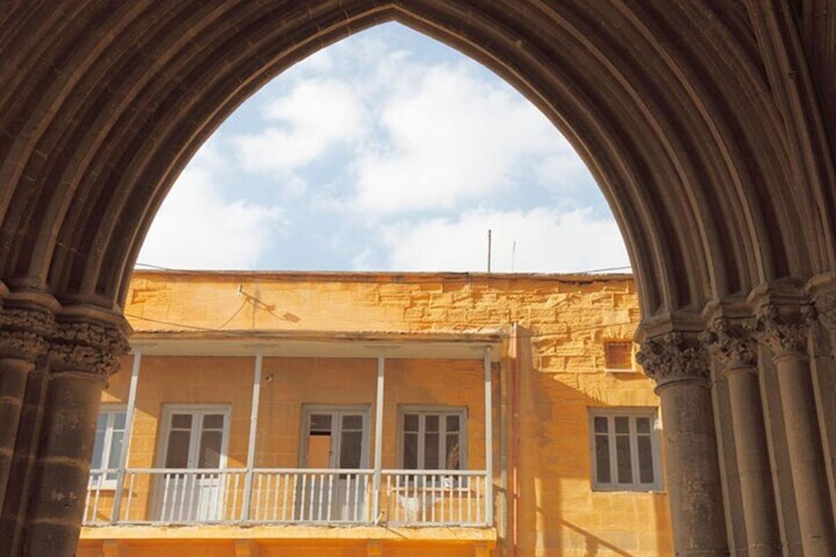 an archway in front of a brick building
