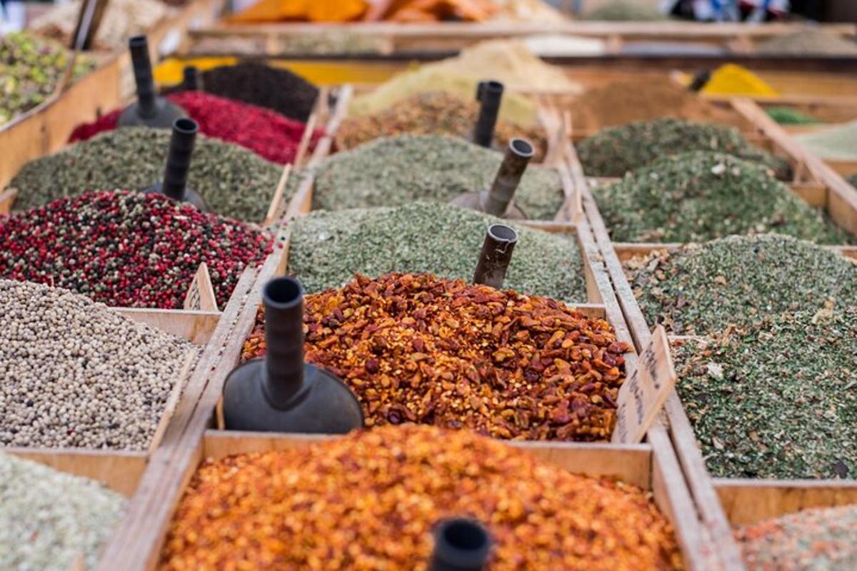 a display of different types of spices in wooden boxes