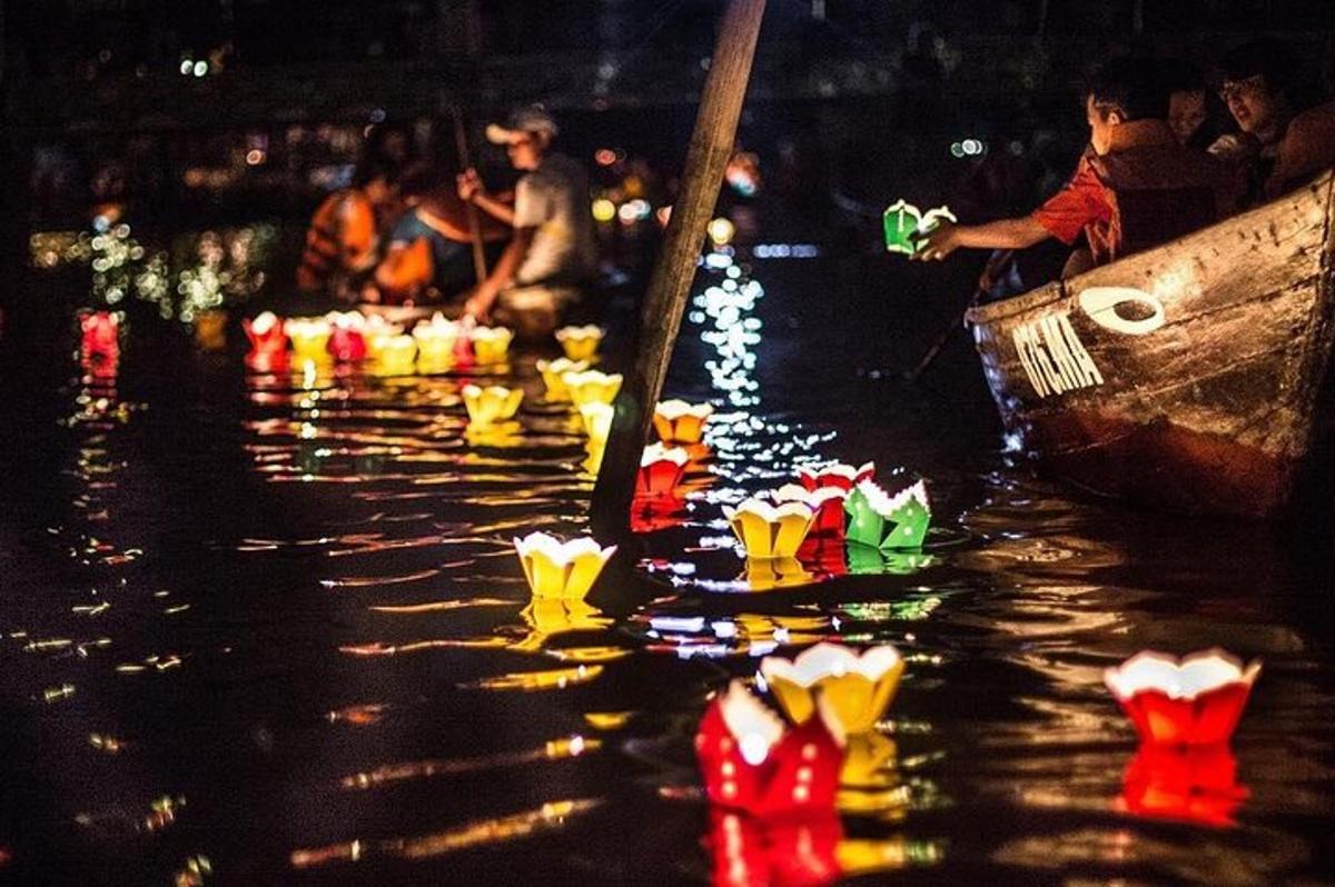 a group of boats in the water at night