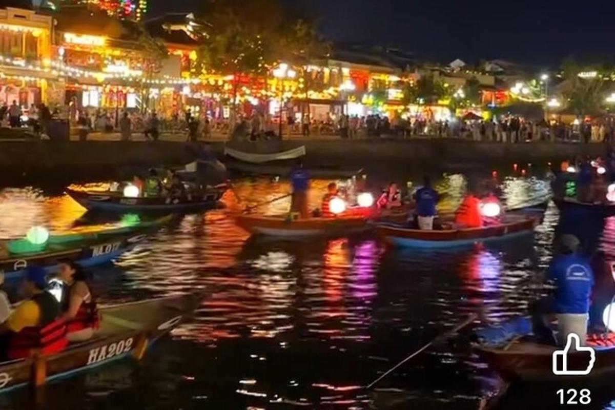 a group of boats in the water at night