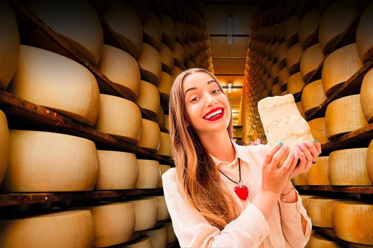 uma mulher segurando um pedaço de queijo em uma adega