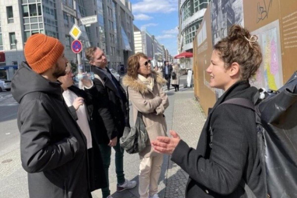 a group of people standing on a city street