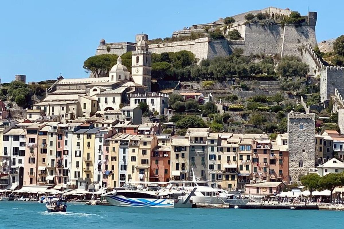 a group of buildings and boats in a harbor