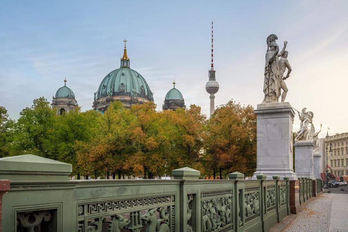 a bridge with a statue in front of a building