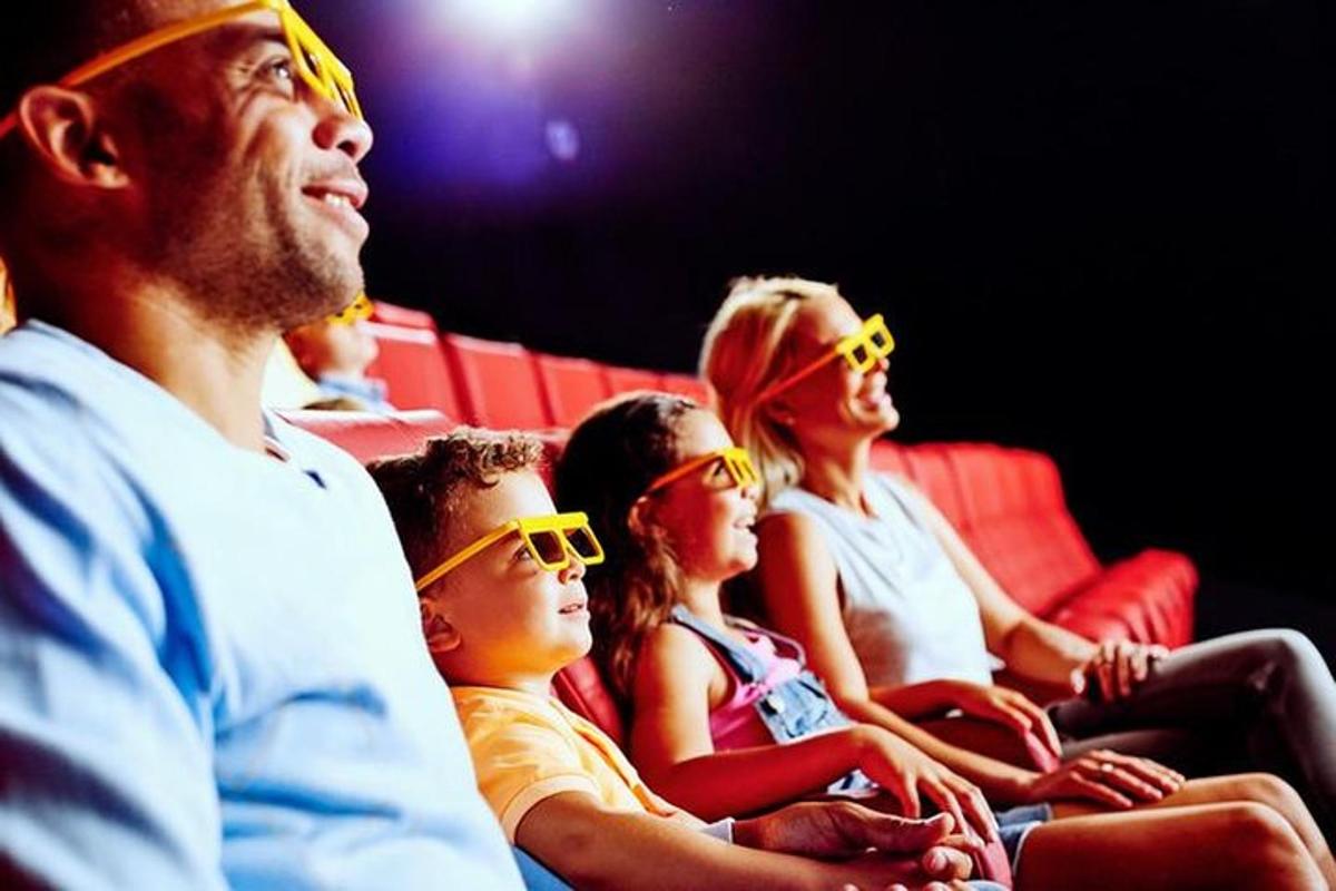 a group of people sitting in the audience wearing sunglasses