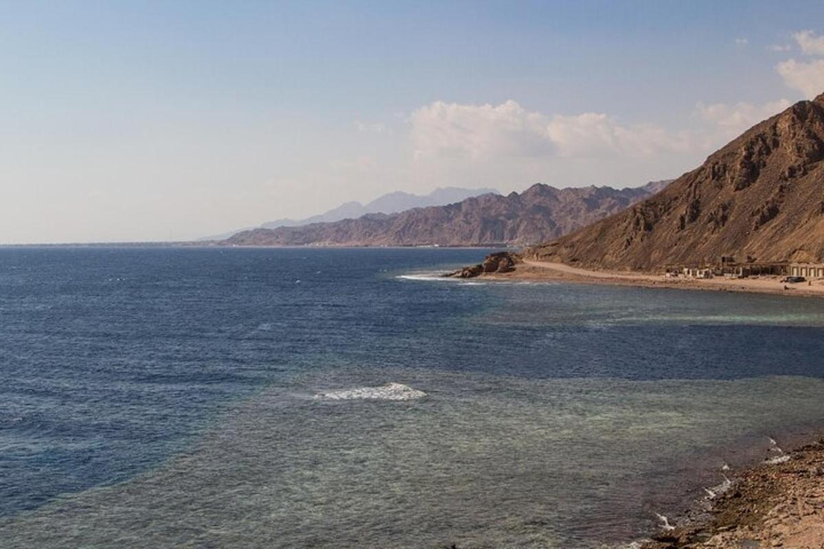 a large body of water with a mountain