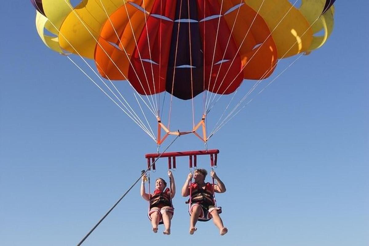 a group of people riding on a parachute