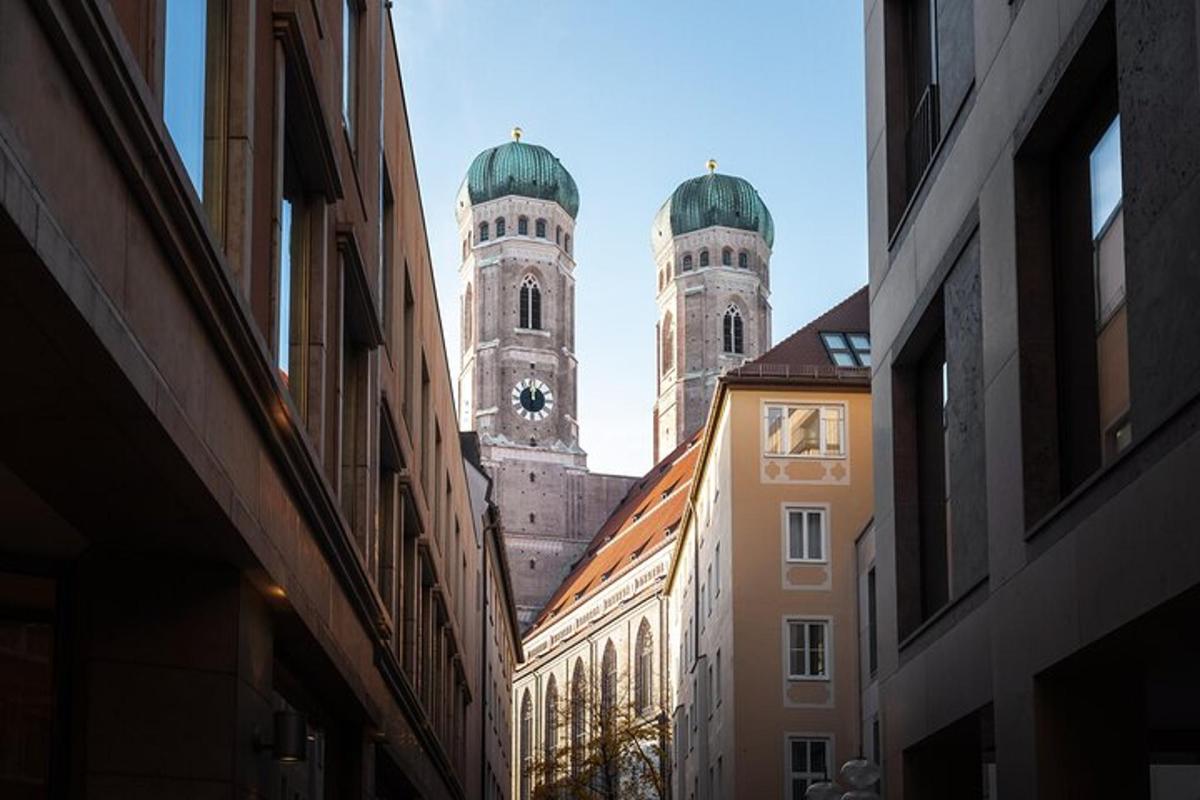 a view of two towers from an alley between buildings