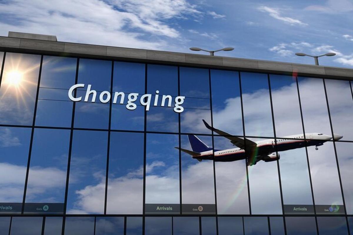 an airplane is flying reflected in the glass of a building