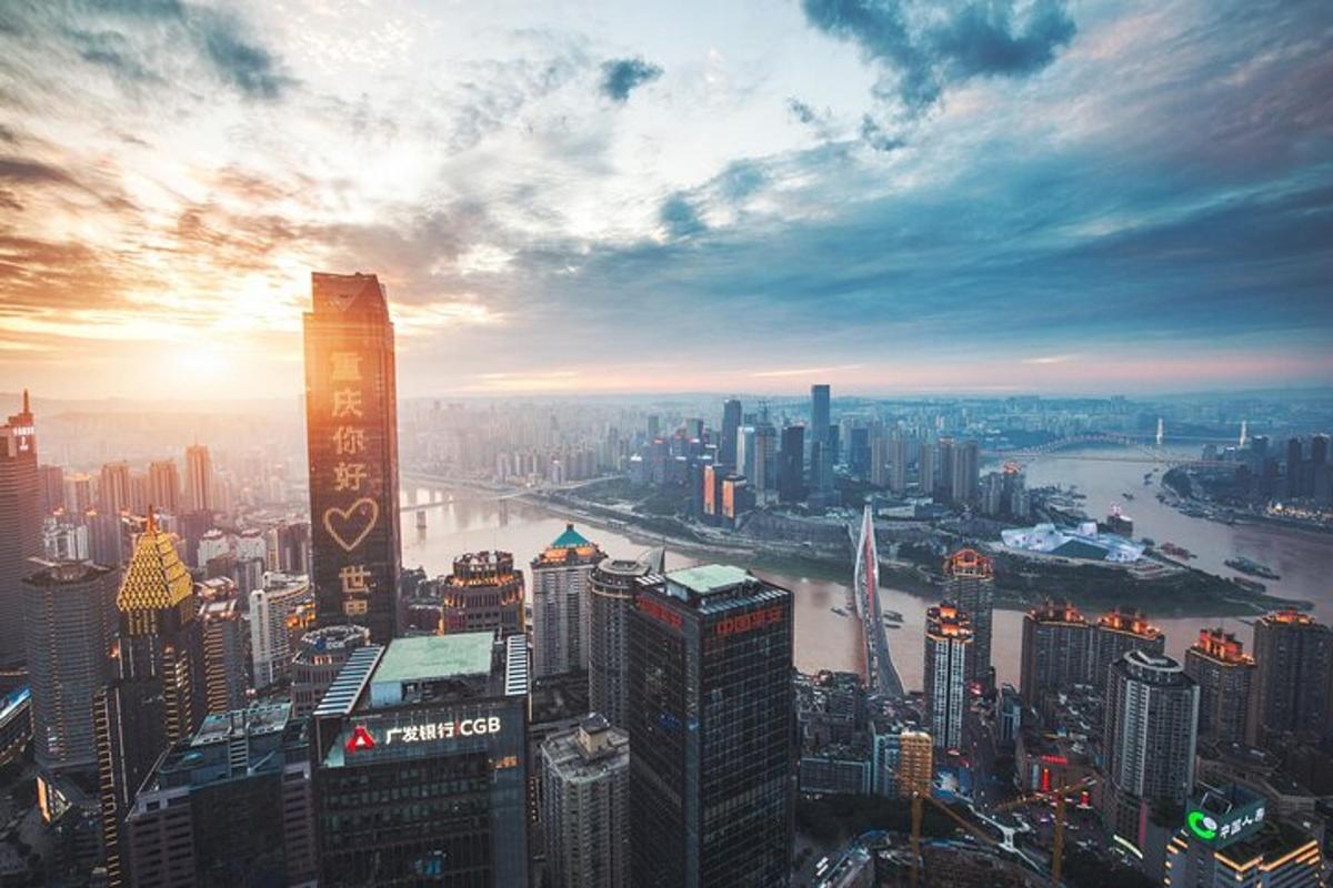 a view of a large city with a sunset