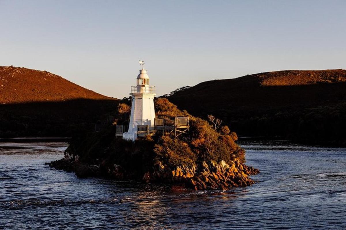 a lighthouse on the edge of a body of water