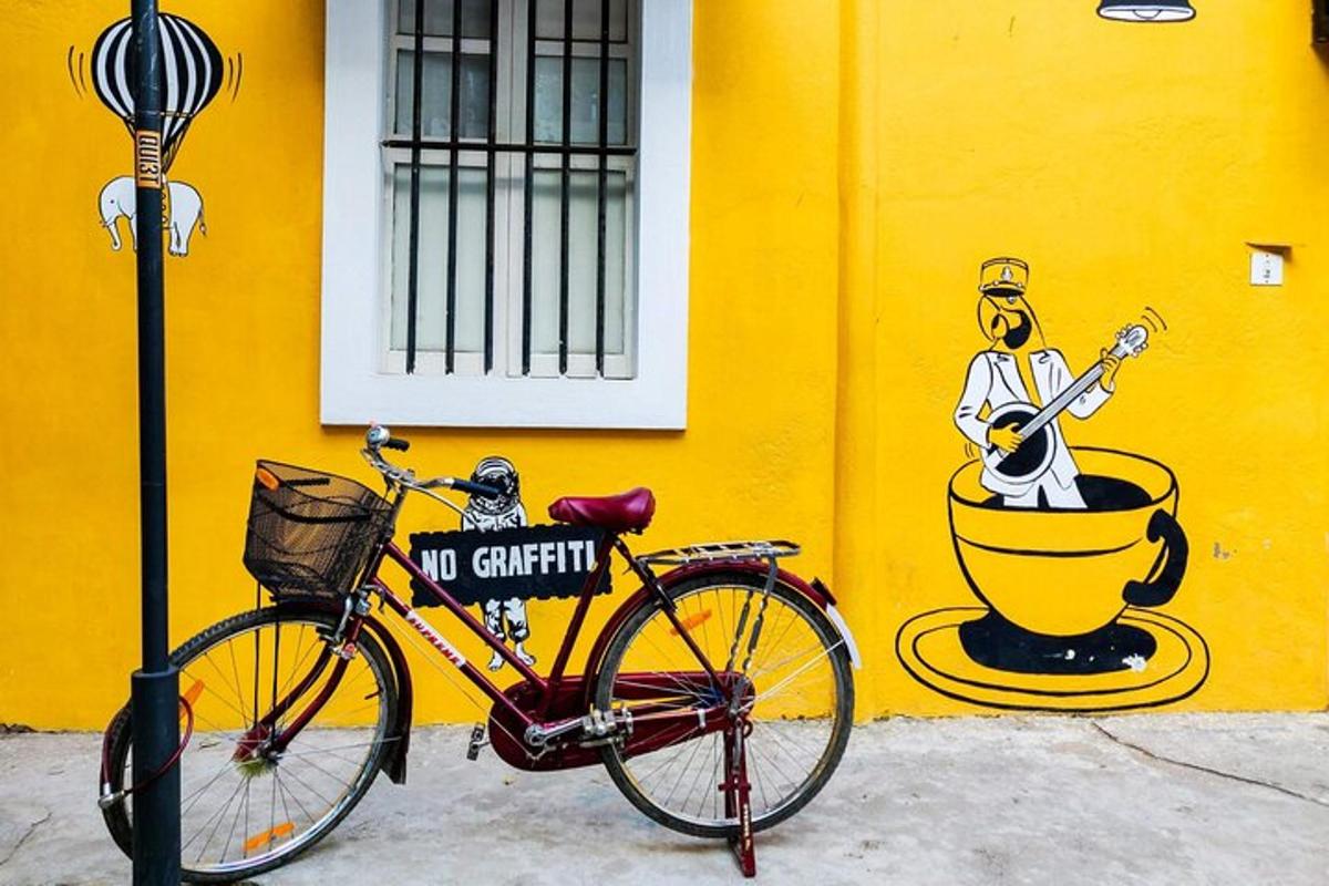 a bike parked next to a yellow wall with a no criticism sign