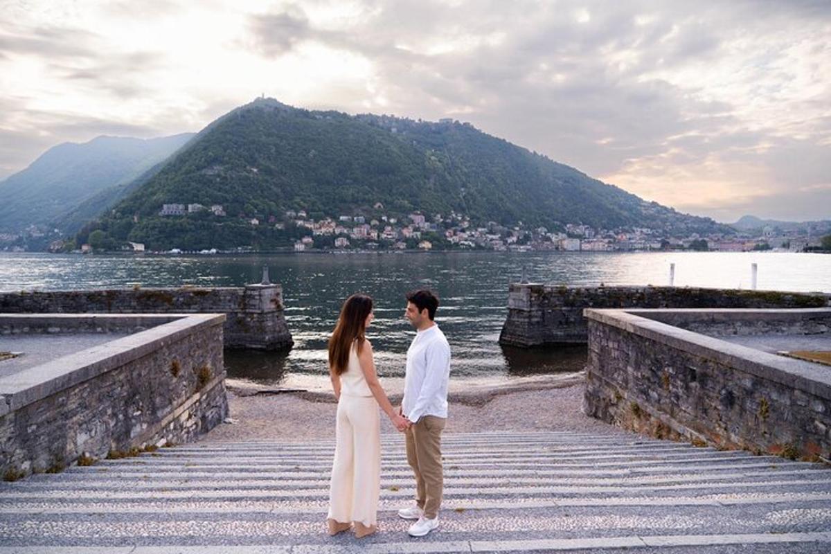 a man and a woman standing on a dock by the water