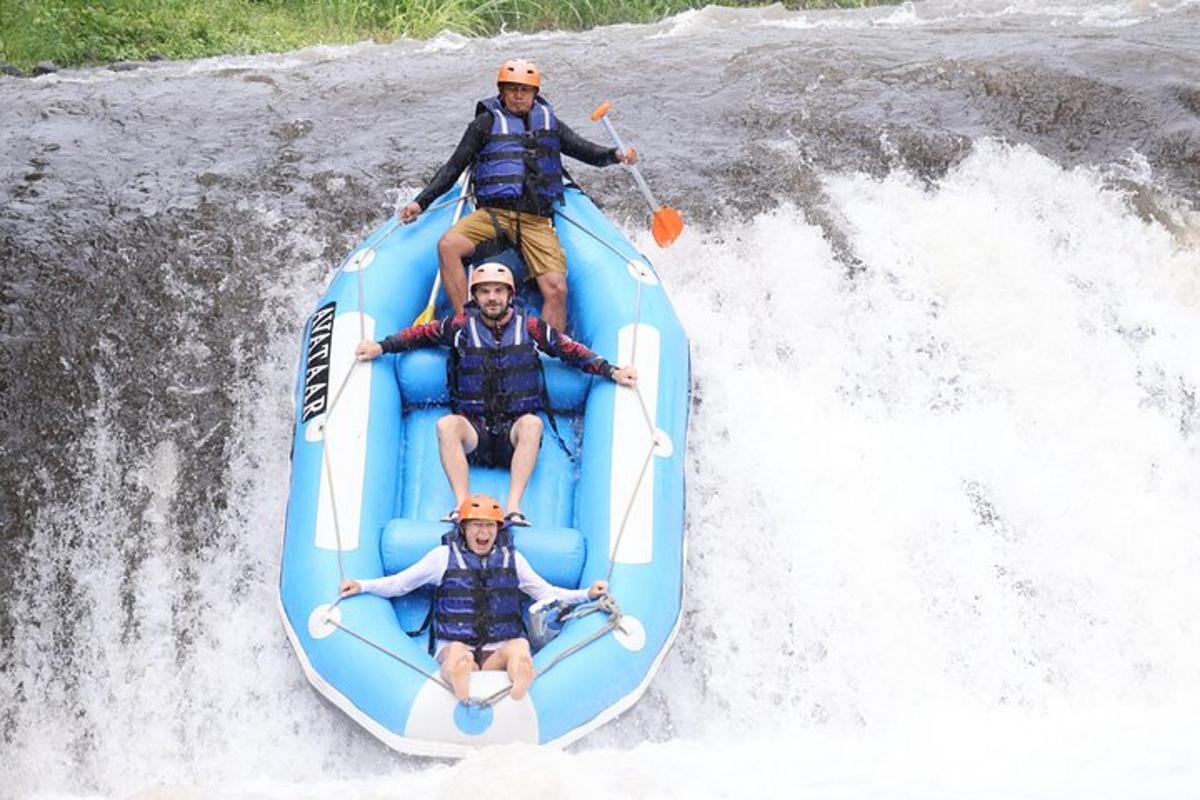 a group of people riding a raft on a river