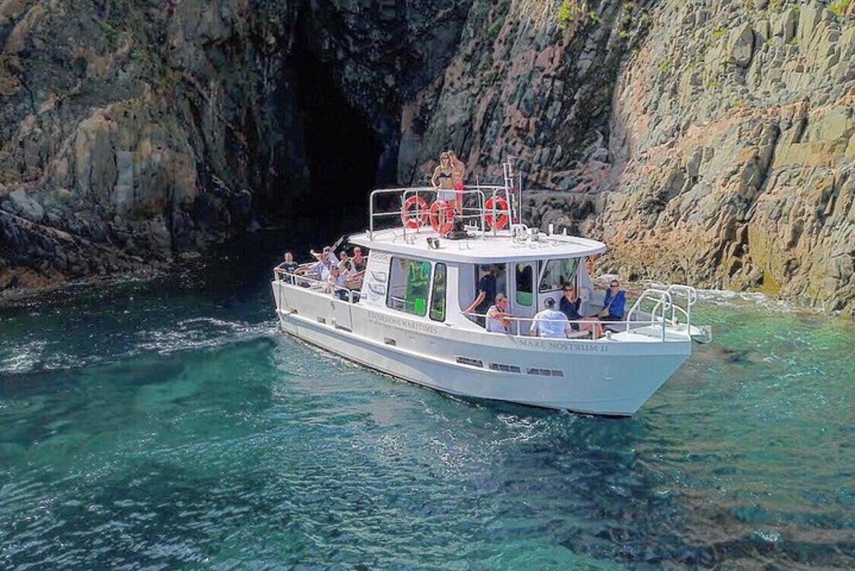 a group of people on a boat in the water